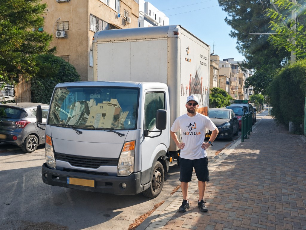 MovilUp team member with branded moving truck